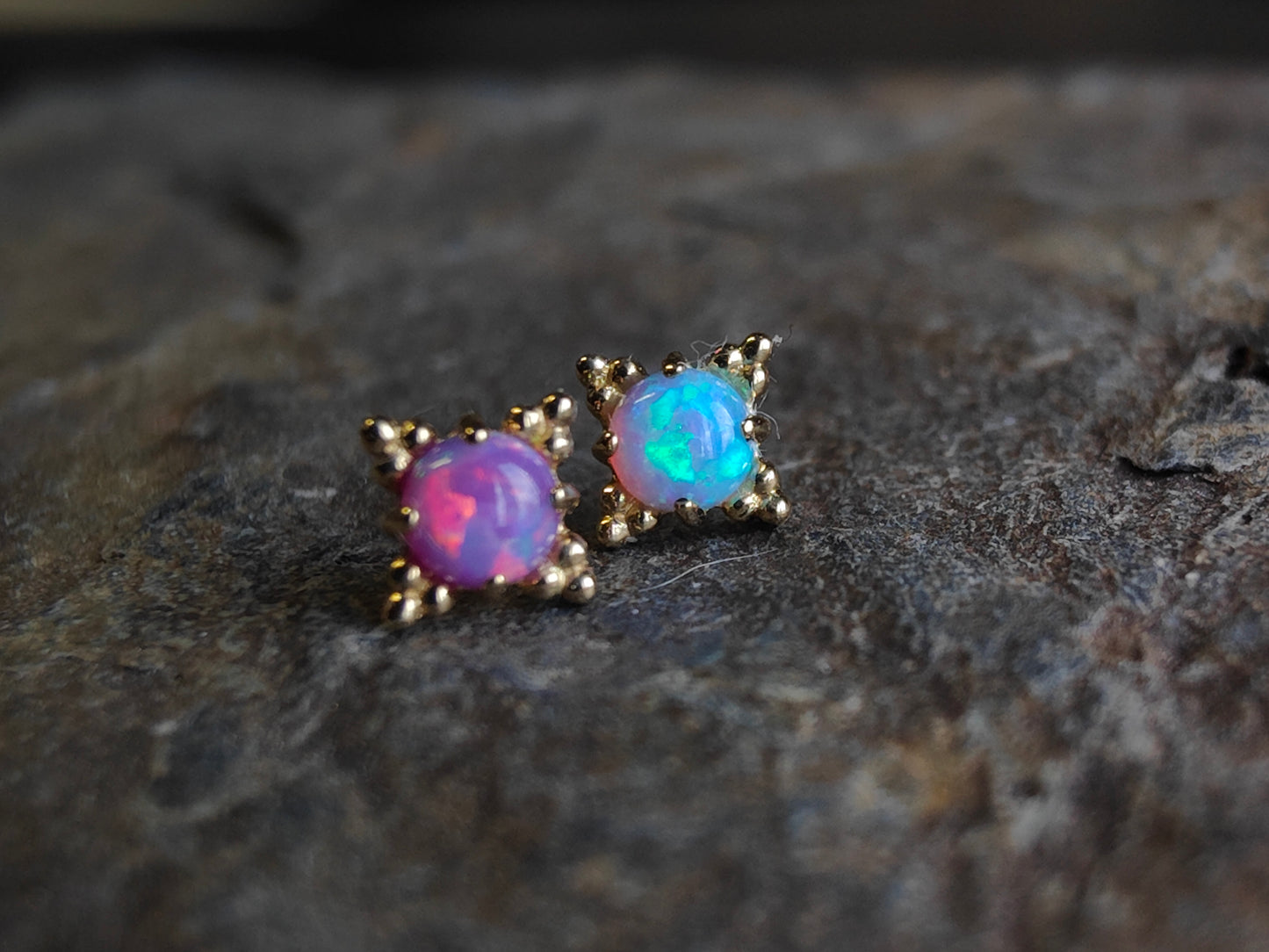 2 solid gold beaded ends, one with a purple opal and one with a blue opal